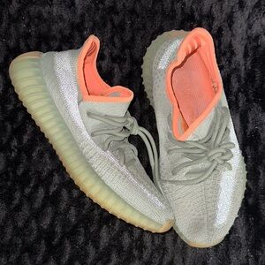 Yeezy Boost 350 grey with orange accent. Reflective.
